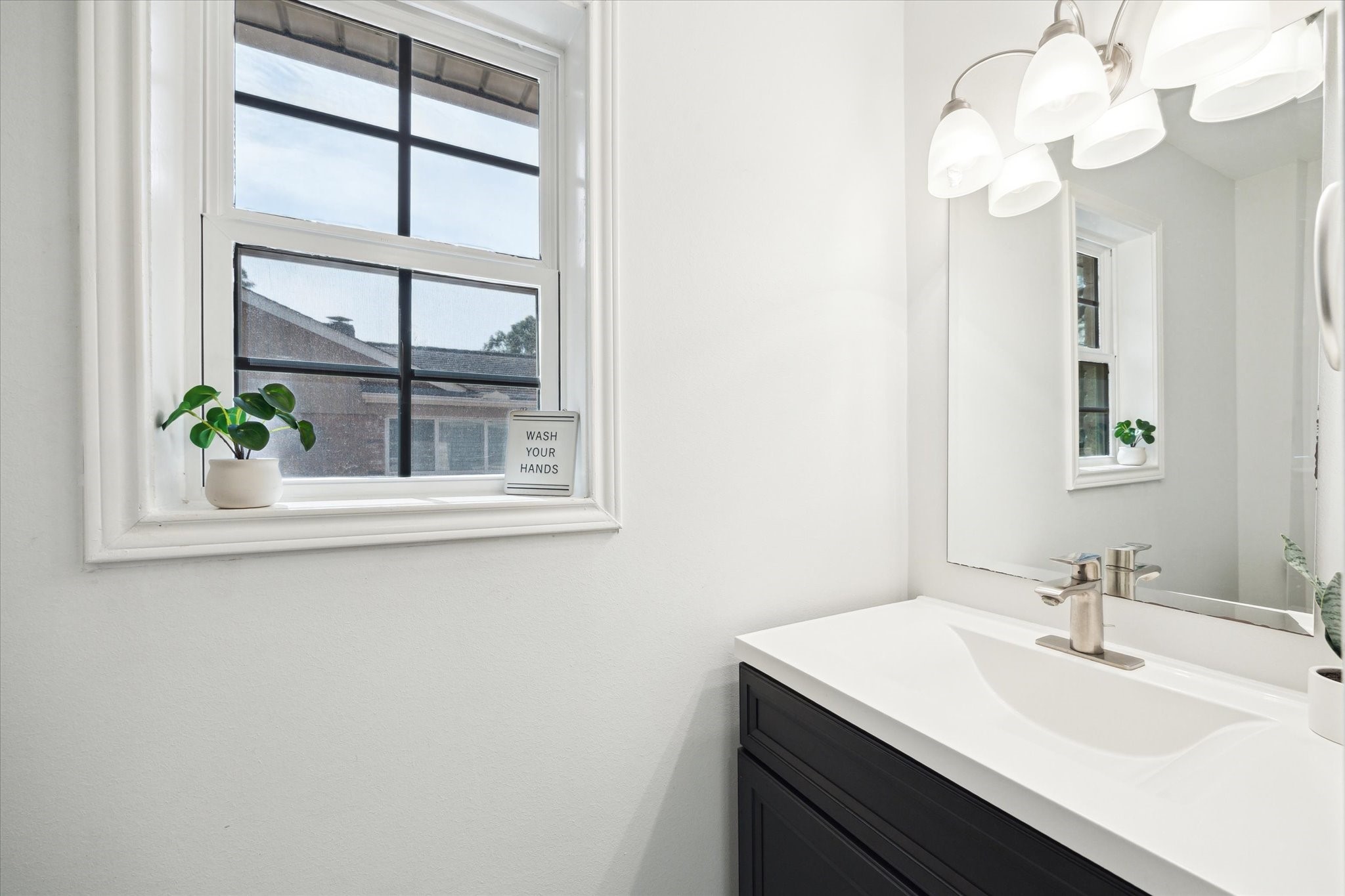 7614 Braesview Lane Houston, TX 77071 - Photo 16 of 29 a bathroom with a sink and a mirror