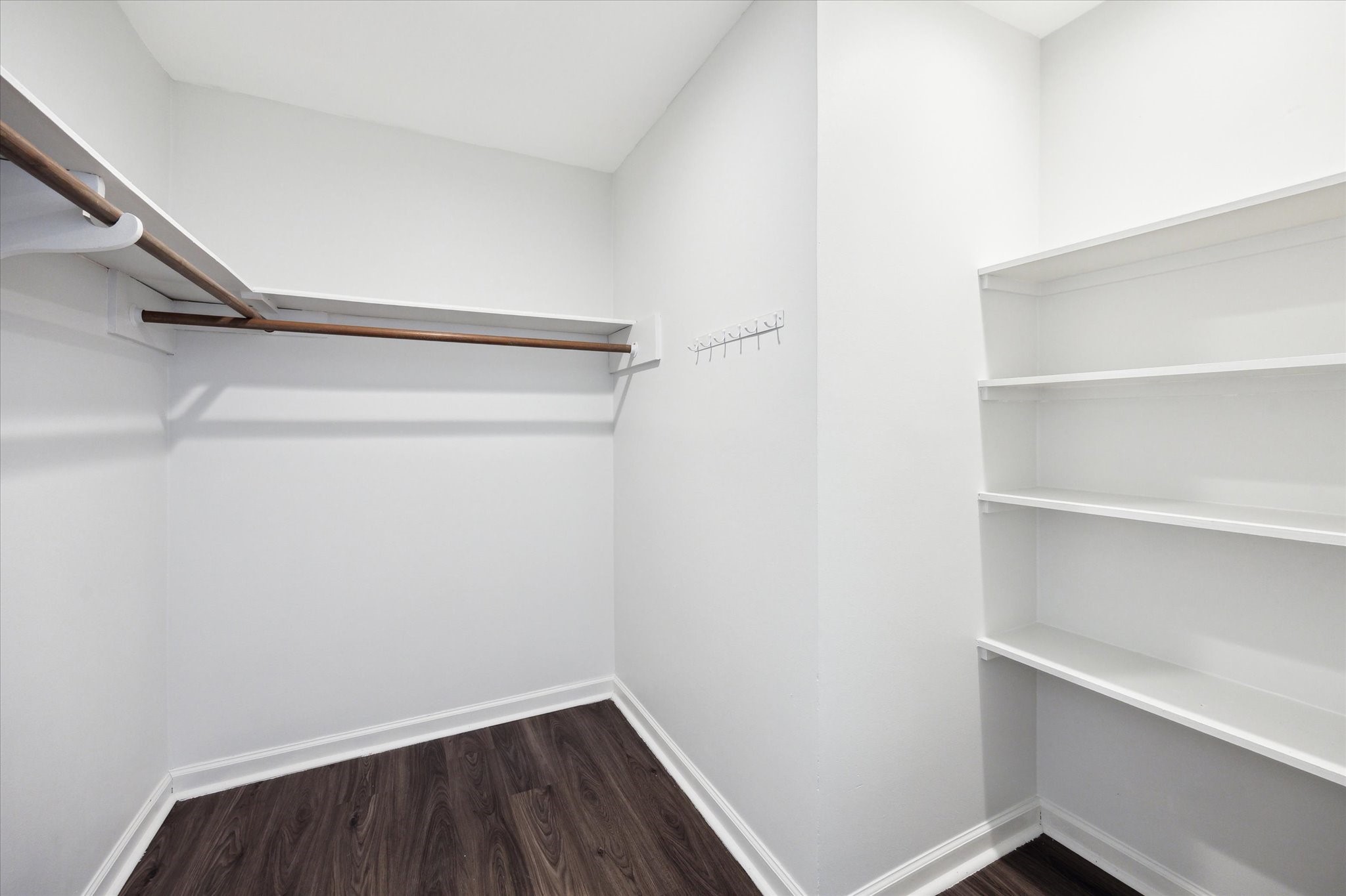 7614 Braesview Lane Houston, TX 77071 - Photo 20 of 29 a view of walk in closet with empty racks