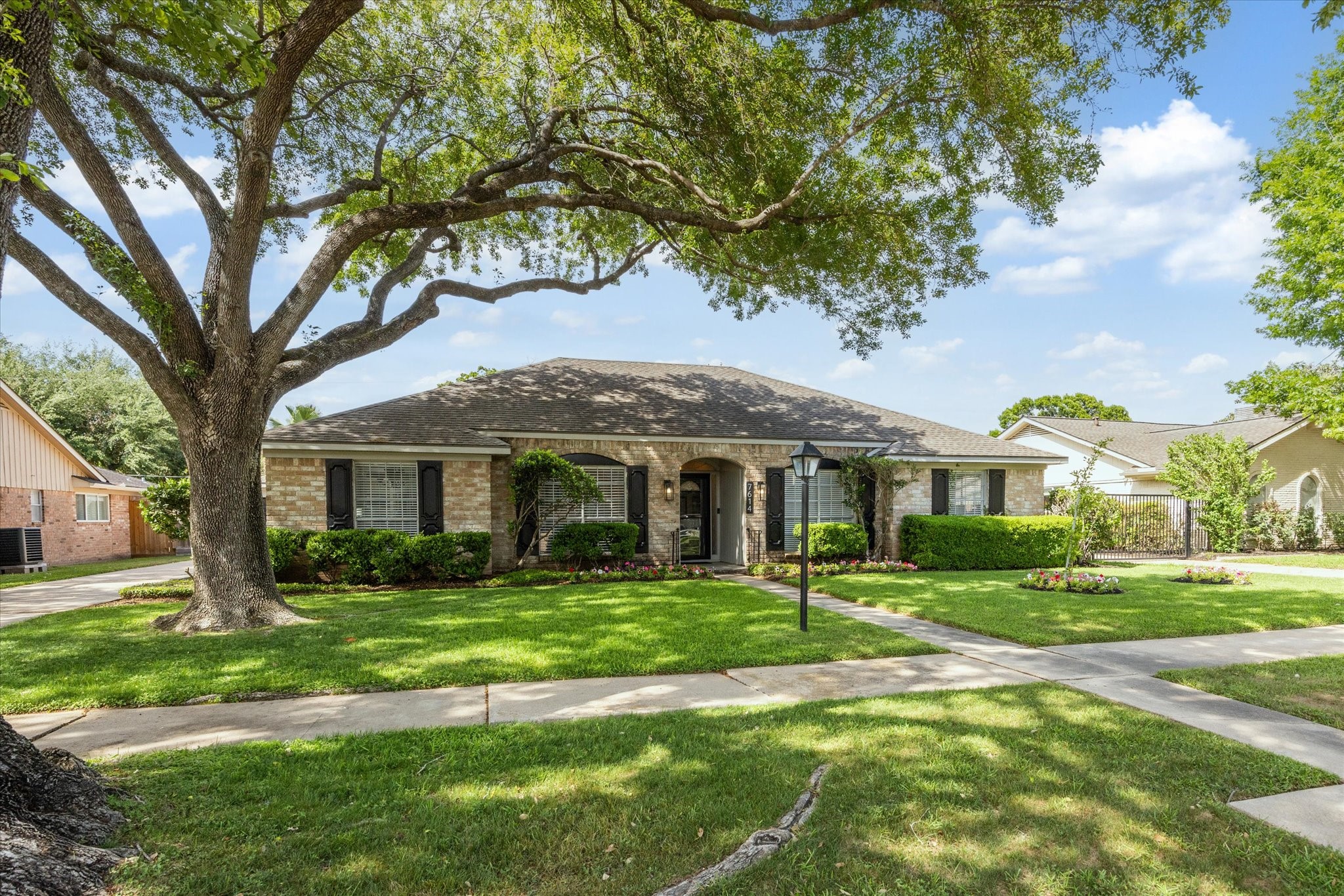 7614 Braesview Lane Houston, TX 77071 - Photo 2 of 29 a front view of a house with a yard