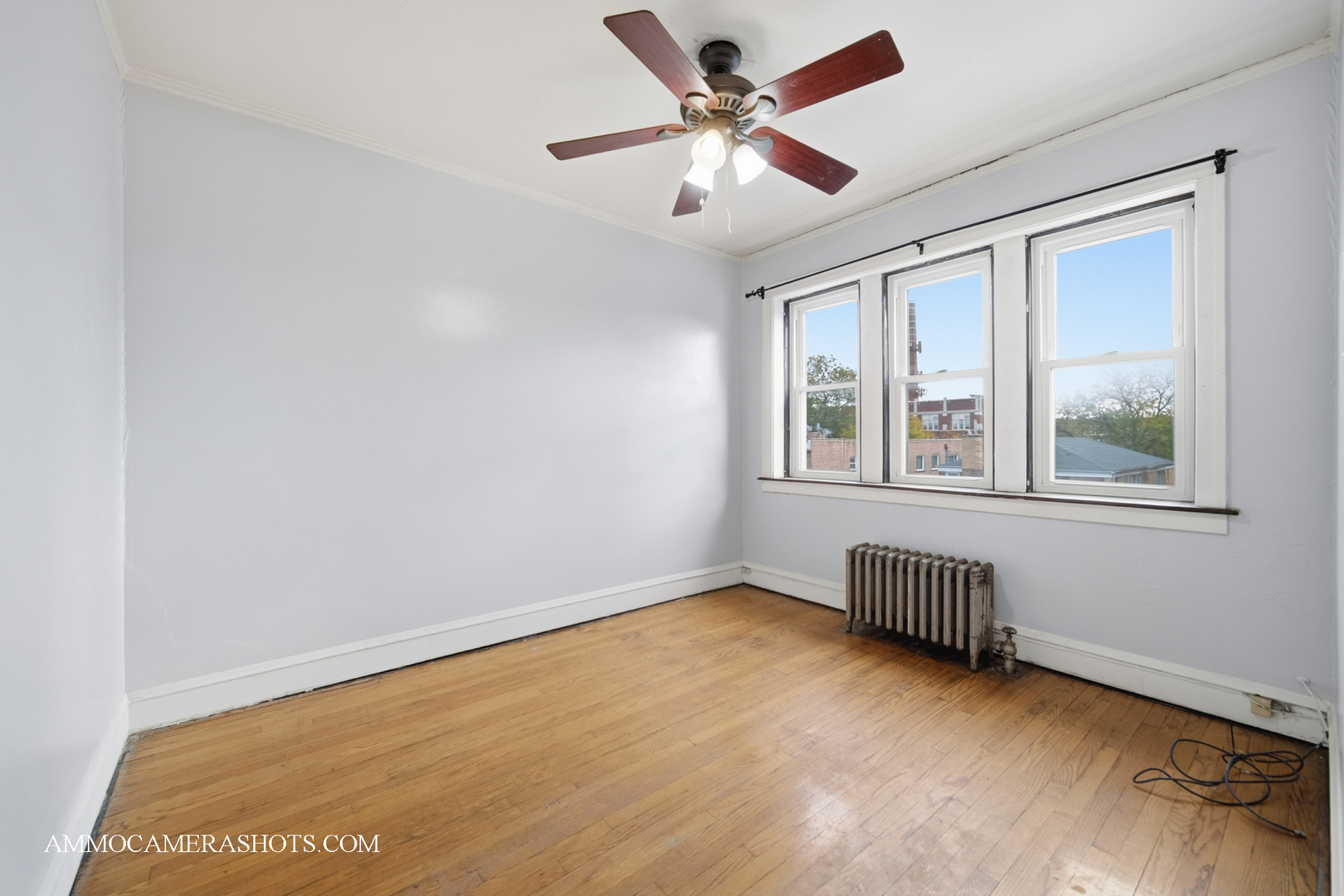 2045 West Farragut Avenue, Unit 3 Chicago, IL 60625 - Photo 22 of 32 a view of an empty room with a window