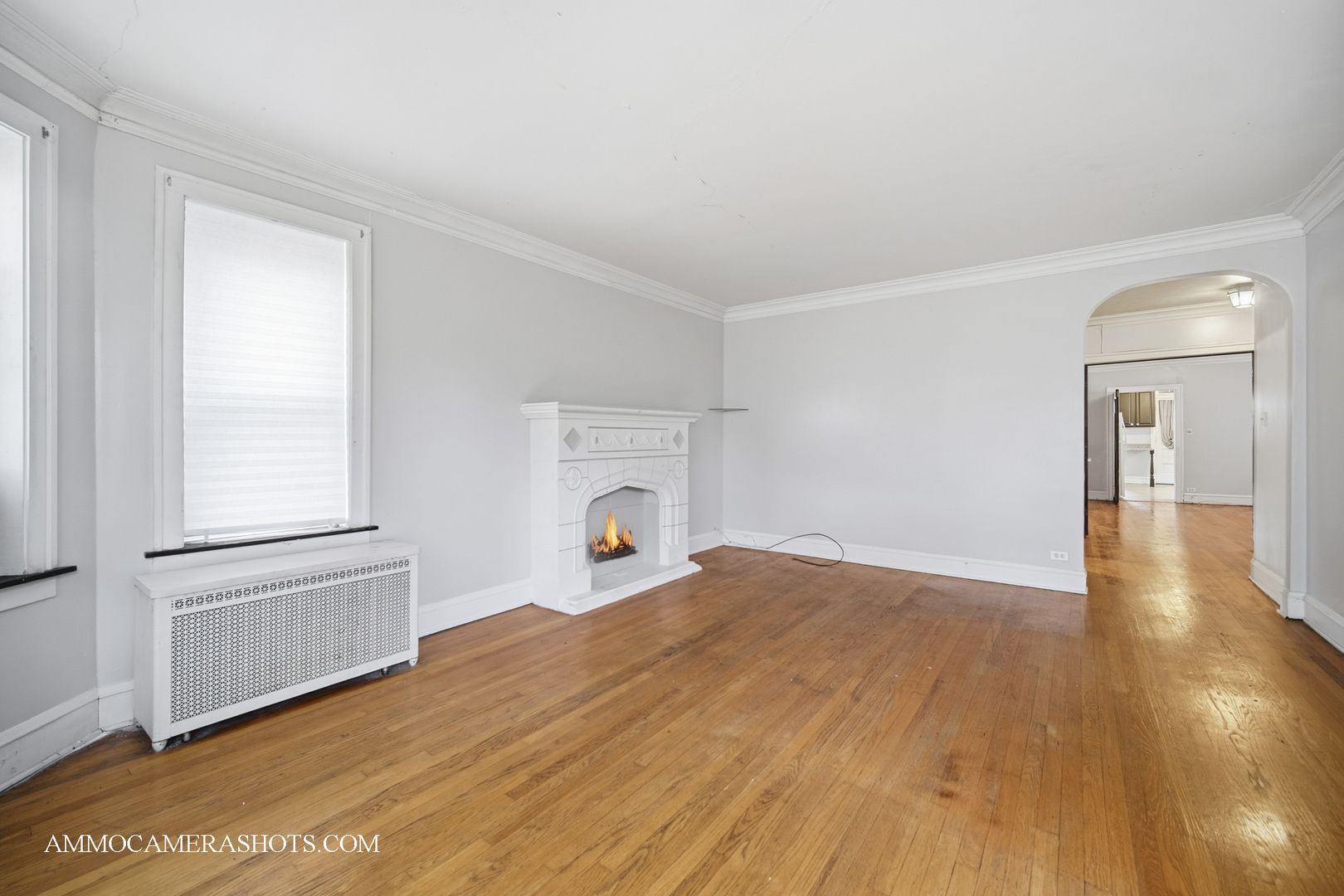 2045 West Farragut Avenue, Unit 3 Chicago, IL 60625 - Photo 24 of 32 a view of empty room with wooden floor and fan