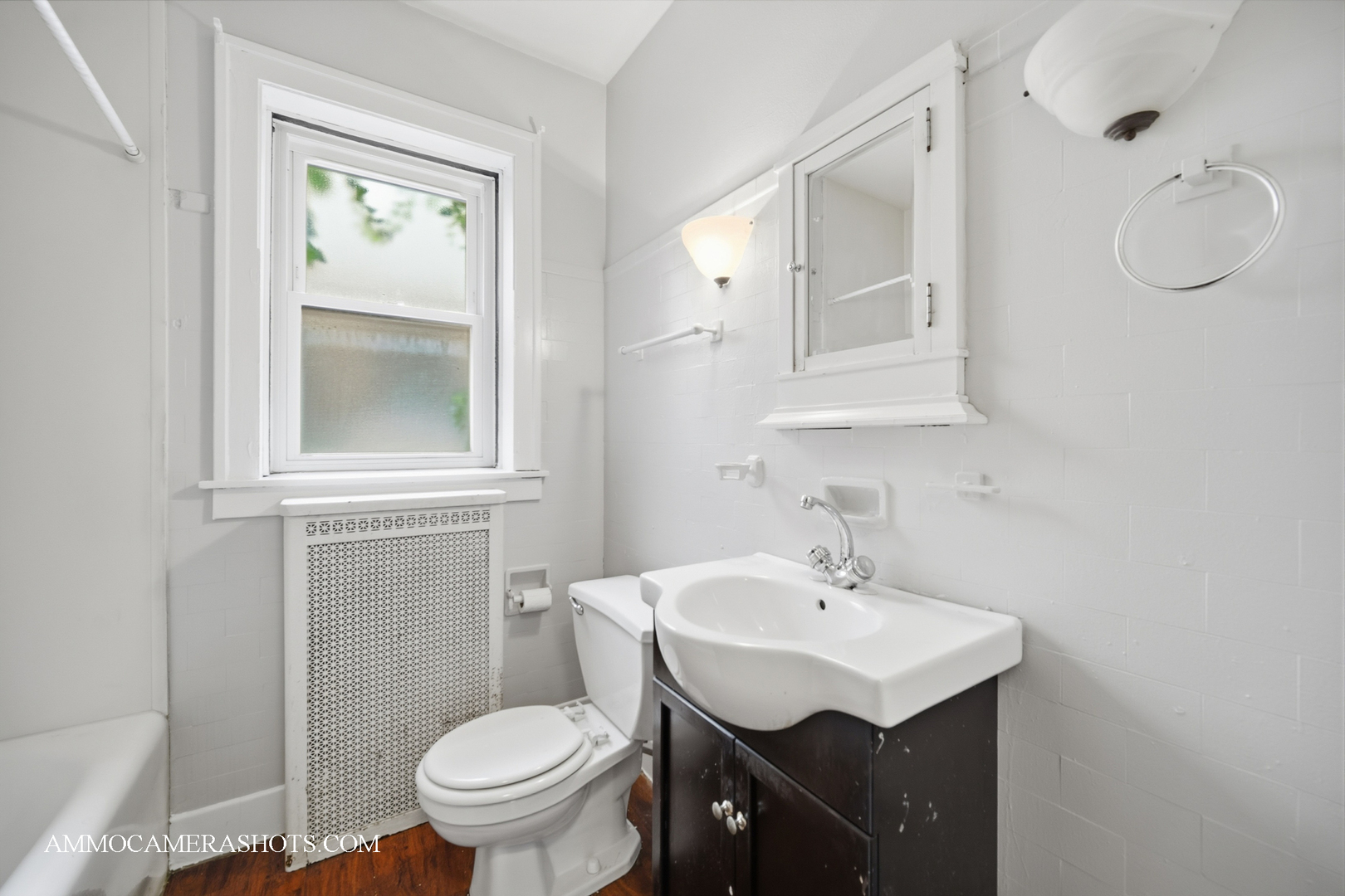 2045 West Farragut Avenue, Unit 3 Chicago, IL 60625 - Photo 25 of 32 a bathroom with a sink toilet and vanity