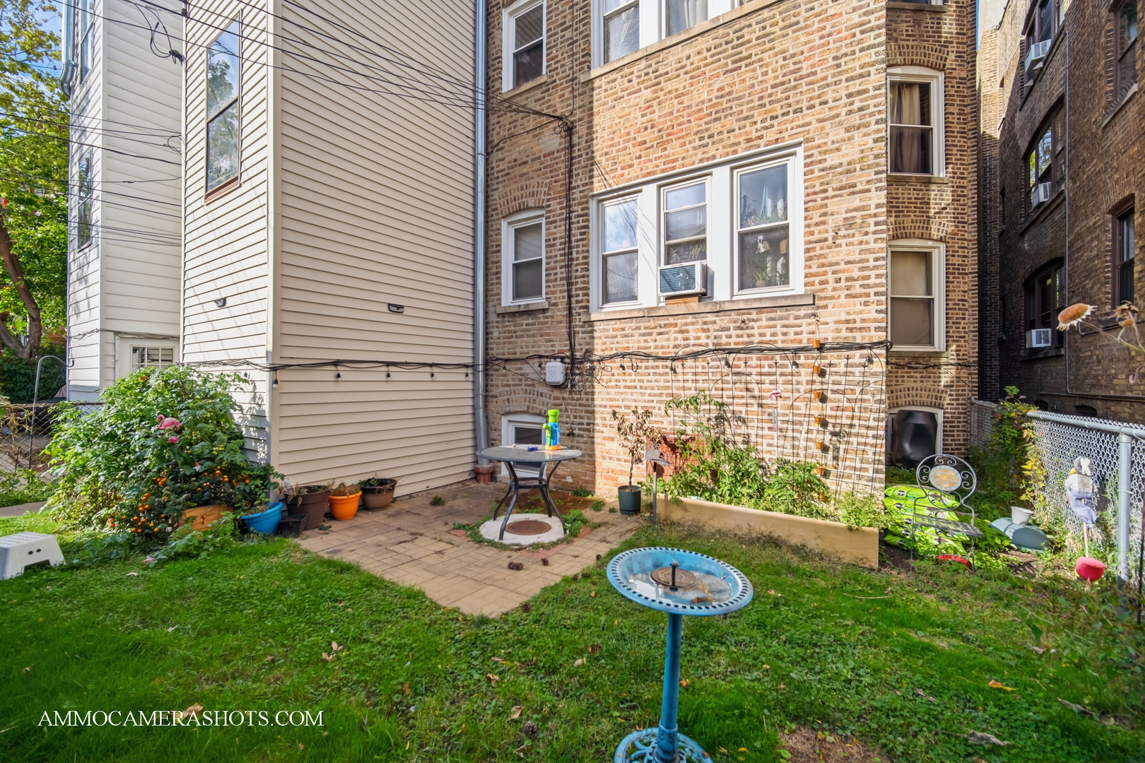 2045 West Farragut Avenue, Unit 3 Chicago, IL 60625 - Photo 7 of 32 a backyard of a house with seating space