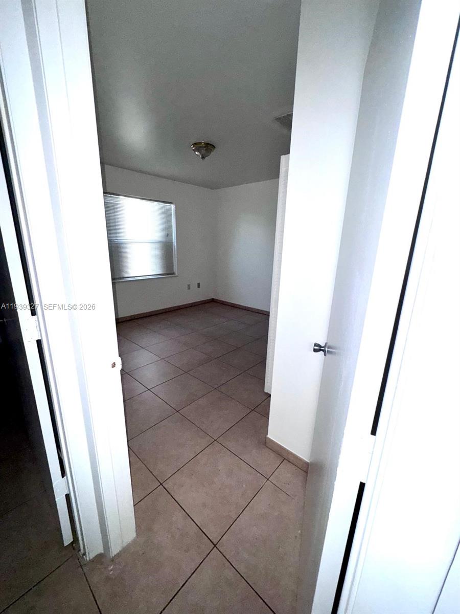 14140 Northeast 2nd Court, Unit 2 Miami, FL 33161 - Photo 8 of 13 a view of a hallway