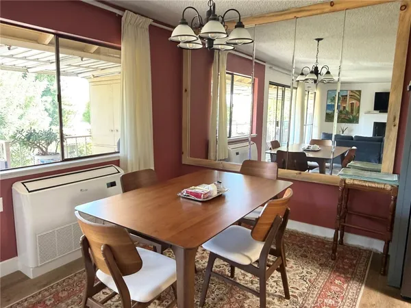 a view of a dining room with furniture window and outside view
