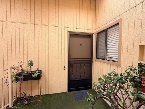 view of a room with a door and a chair