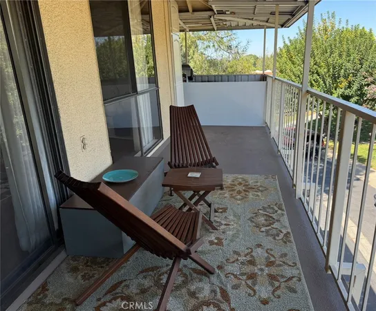 a view of balcony with furniture