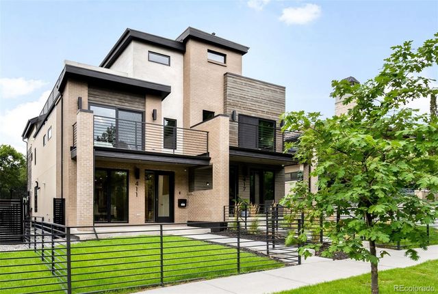 a view of a house with sitting area and garden