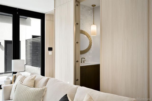 a bedroom with a bed and a mirror