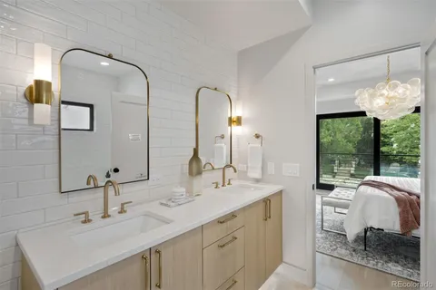 a bathroom with a double vanity sink and a mirror