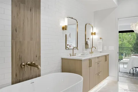 a bathroom with a double vanity sink and mirror