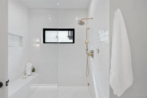 a bathroom with a bathtub and a shower