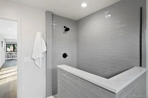 a bathroom with a bathtub and shower