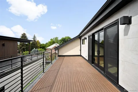a view of balcony with wooden floor
