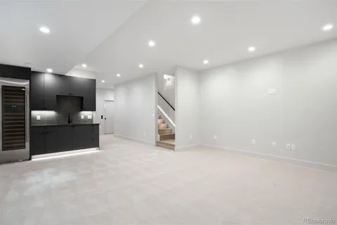 a view of an empty room with a fireplace