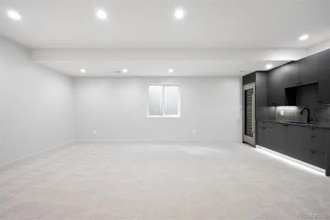 a view of an empty room and a window