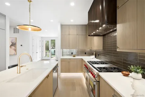 a kitchen with a stove and a sink