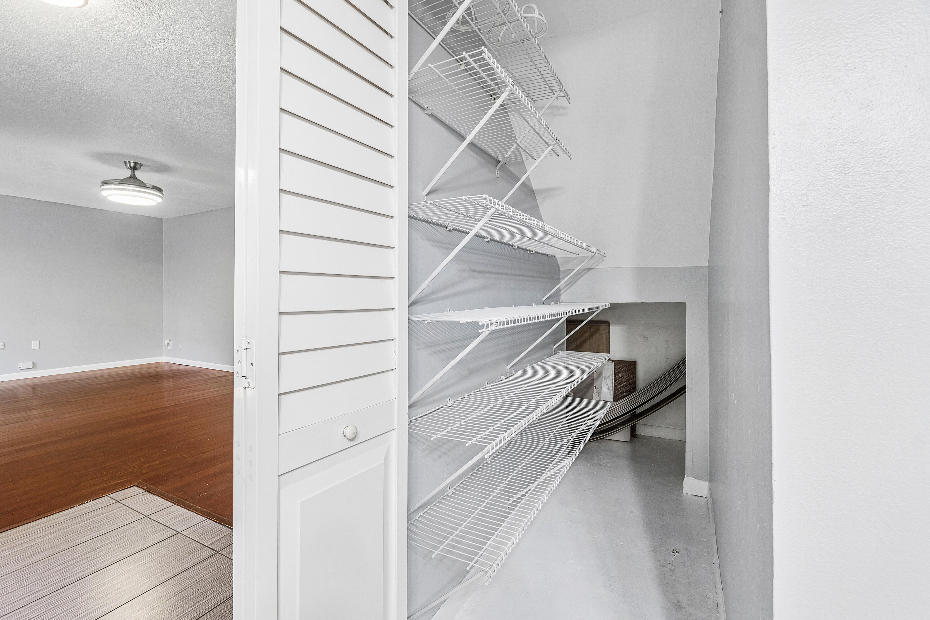 7536 Courtyard Run East Boca Raton, FL 33433 - Photo 15 of 25 a view of walk in closet with empty racks