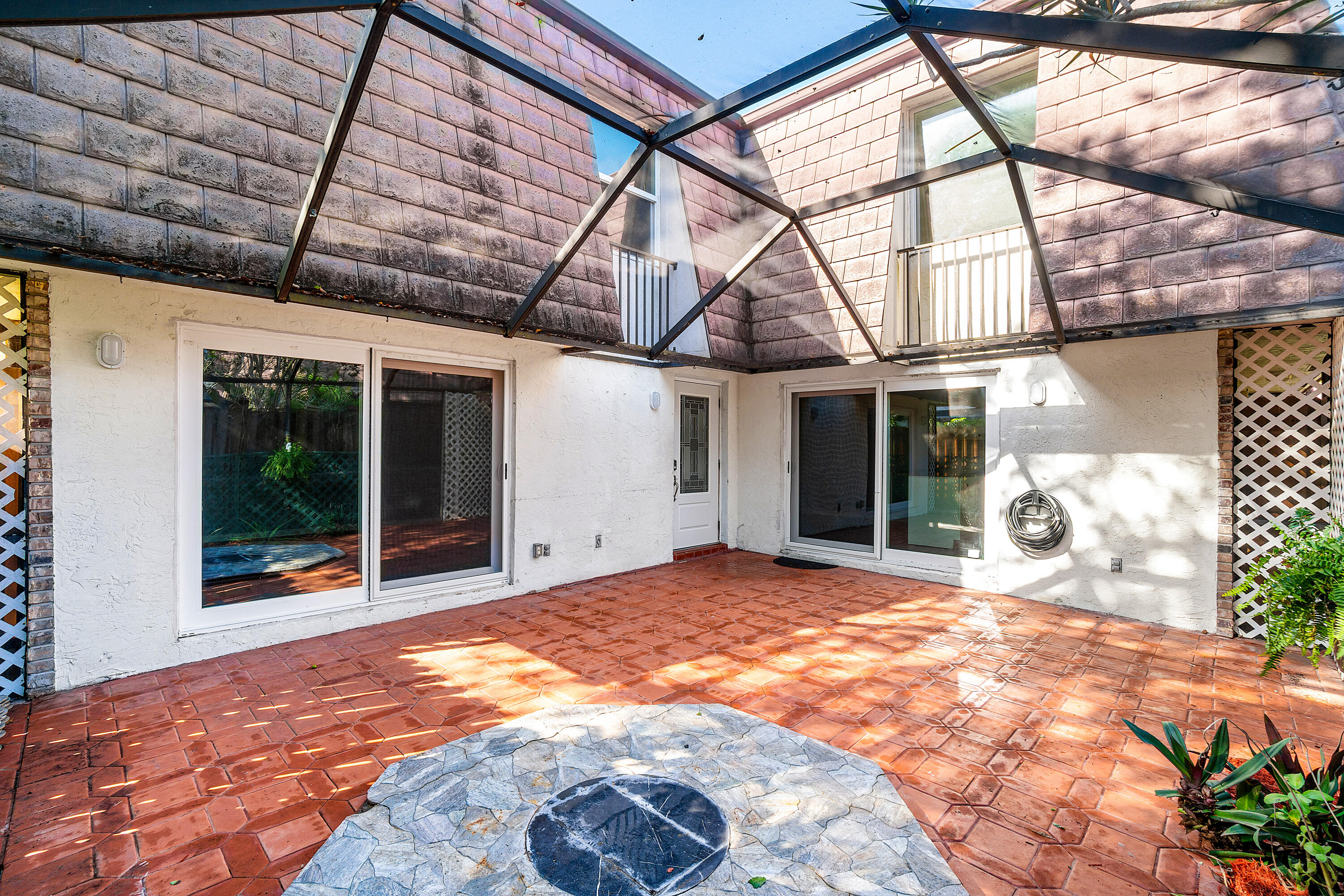 7536 Courtyard Run East Boca Raton, FL 33433 - Photo 3 of 25 a view of a house with a patio