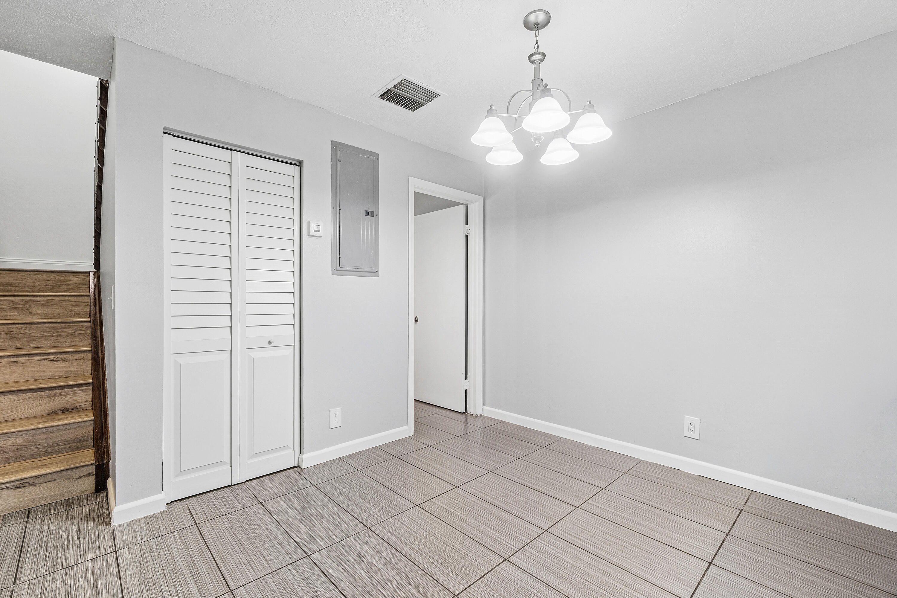 7536 Courtyard Run East Boca Raton, FL 33433 - Photo 9 of 25 an empty room with kitchen view