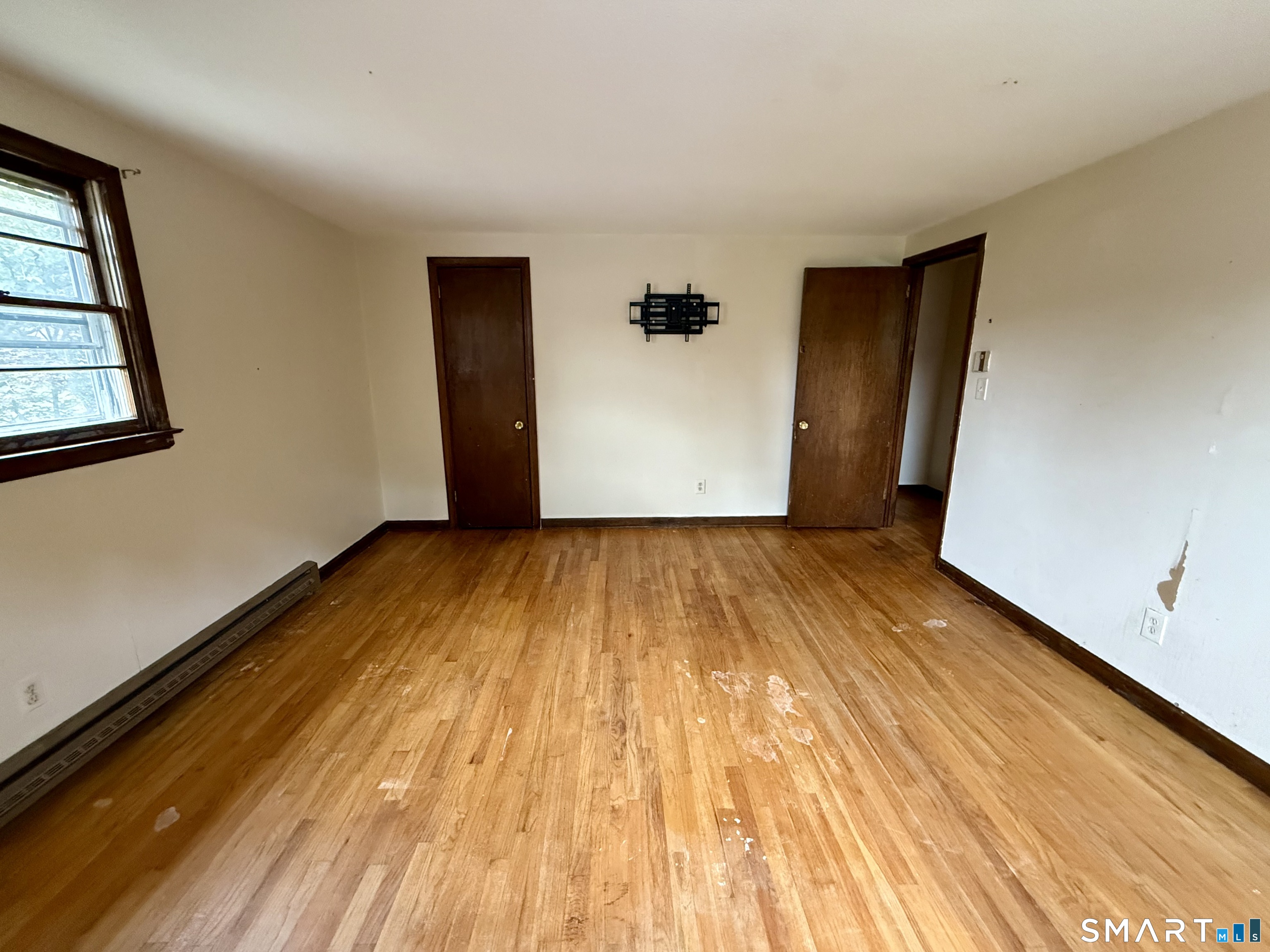 400 Divinity Street Bristol, CT 06010 - Photo 16 of 19 a view of an empty room with wooden floor