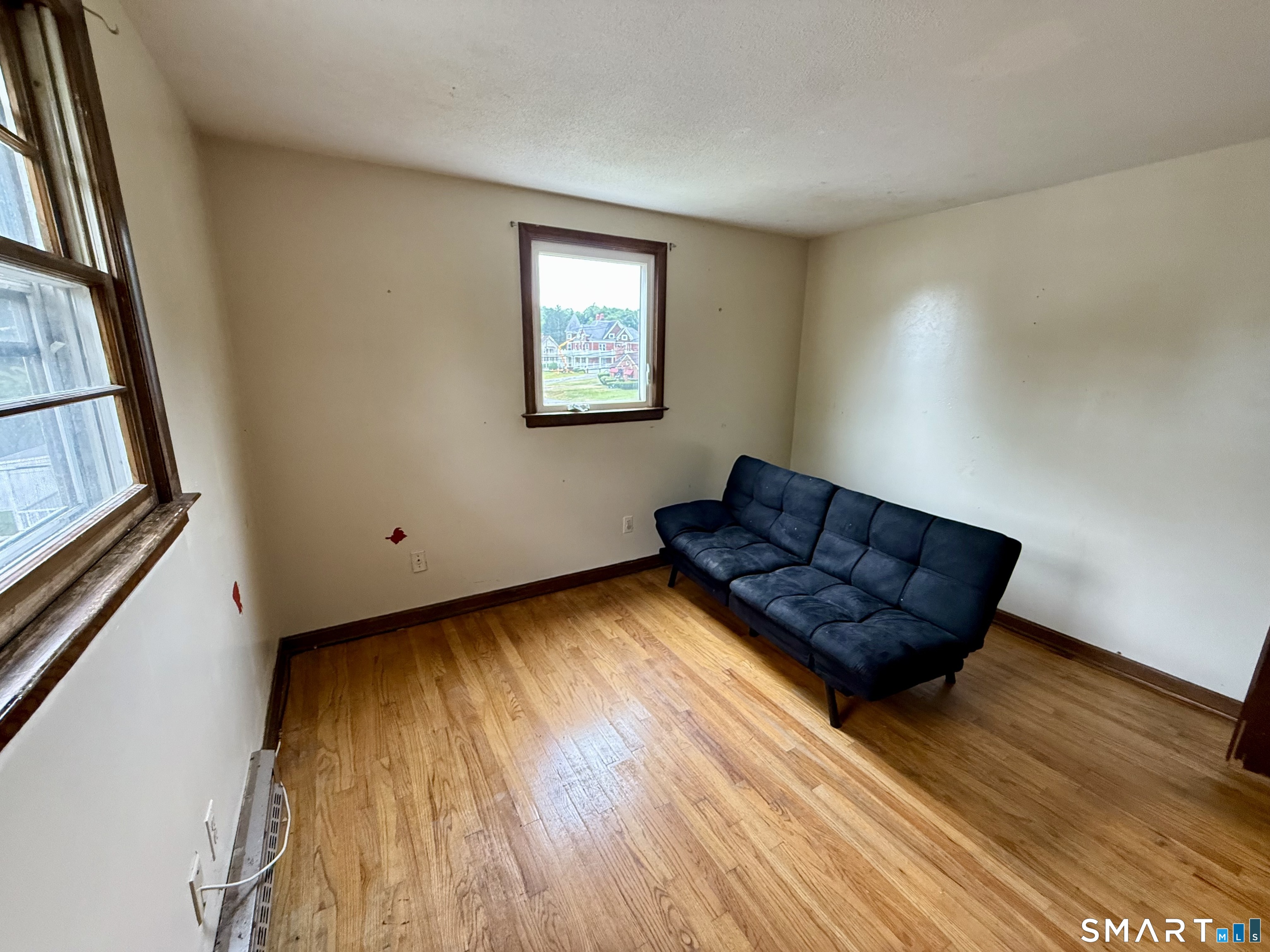 400 Divinity Street Bristol, CT 06010 - Photo 18 of 19 a living room with a couch and a window