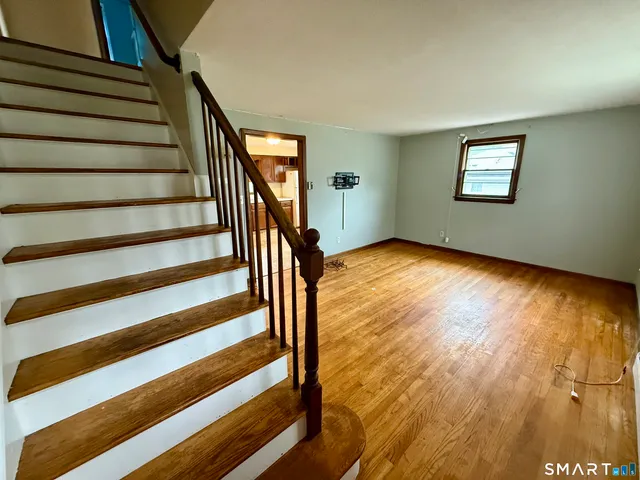 a view of entryway with wooden floor