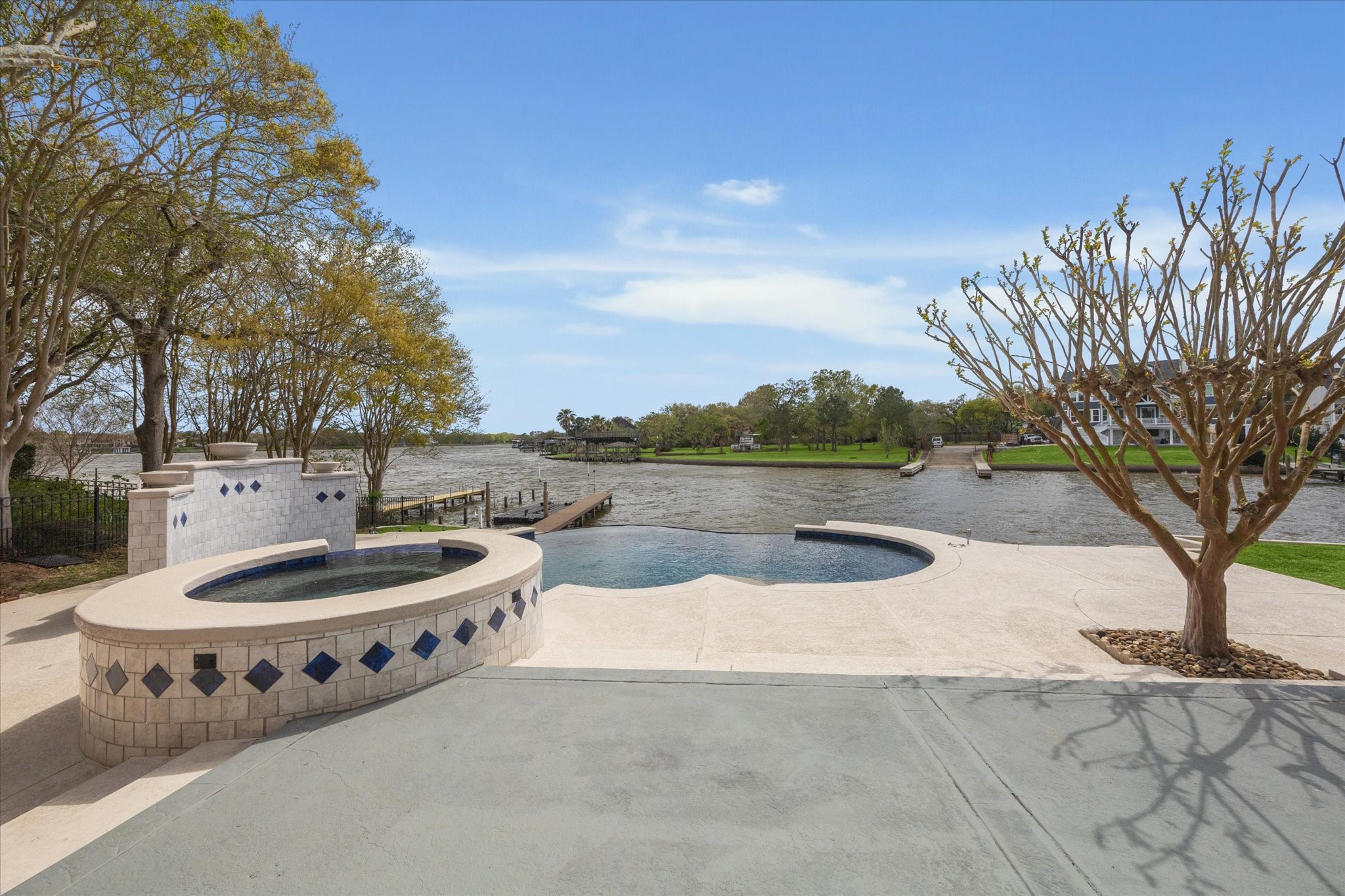 1406 Spring Cress Lane Seabrook, TX 77586 - Photo 41 of 50 A view of the in-ground pool and spa that over look Taylor Lake.