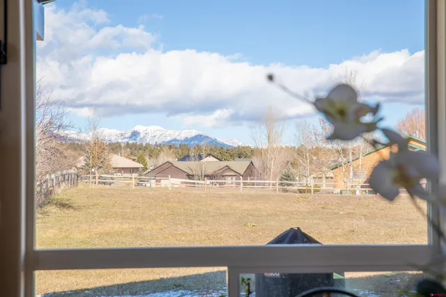 a view of a room with a large window