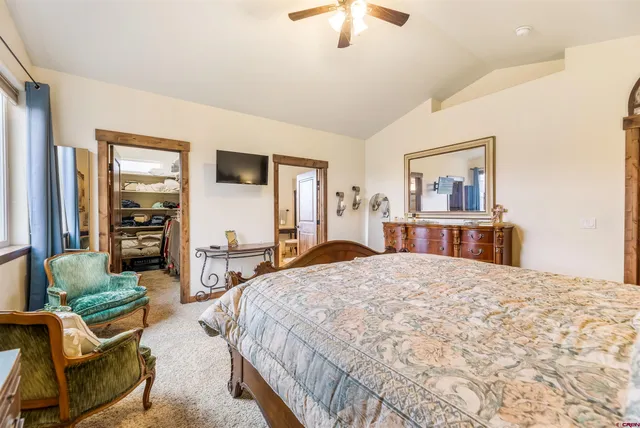 a bathroom with a sink a large mirror and a bathtub
