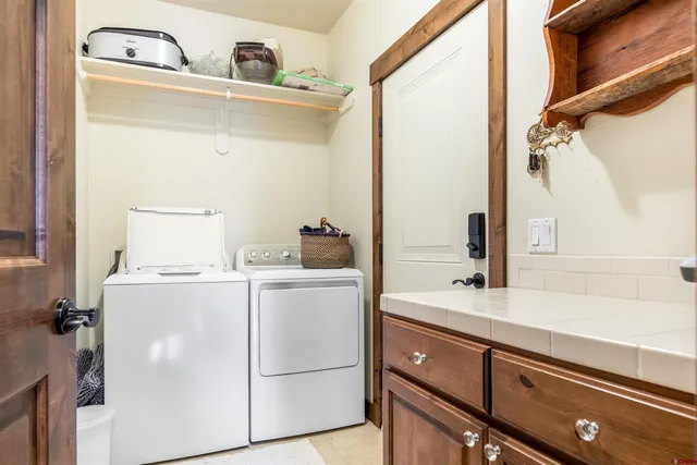 a bedroom with a bed and a table