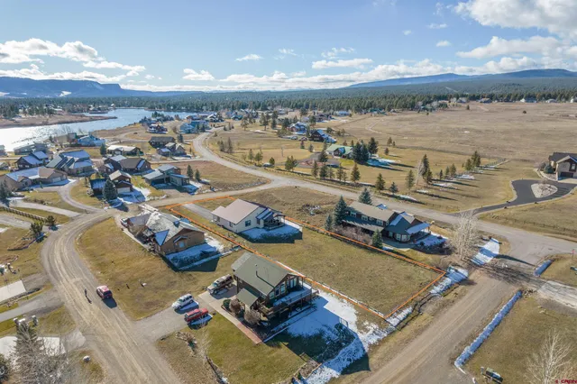 a view of a terrace with lawn chairs