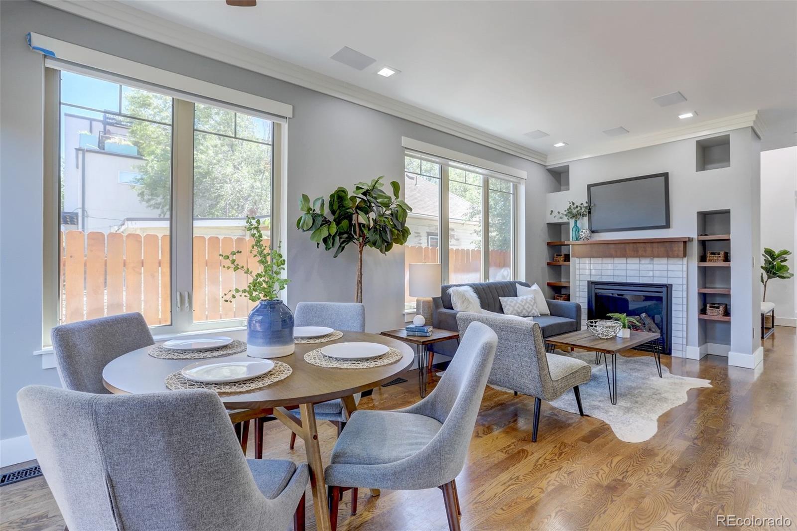 4238 Stuart Street Denver, CO 80212 - Photo 14 of 50 a view of a dining room with furniture window and wooden floor