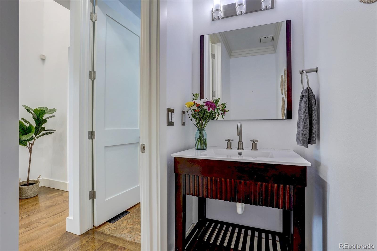 4238 Stuart Street Denver, CO 80212 - Photo 18 of 50 a bathroom with a sink and a mirror