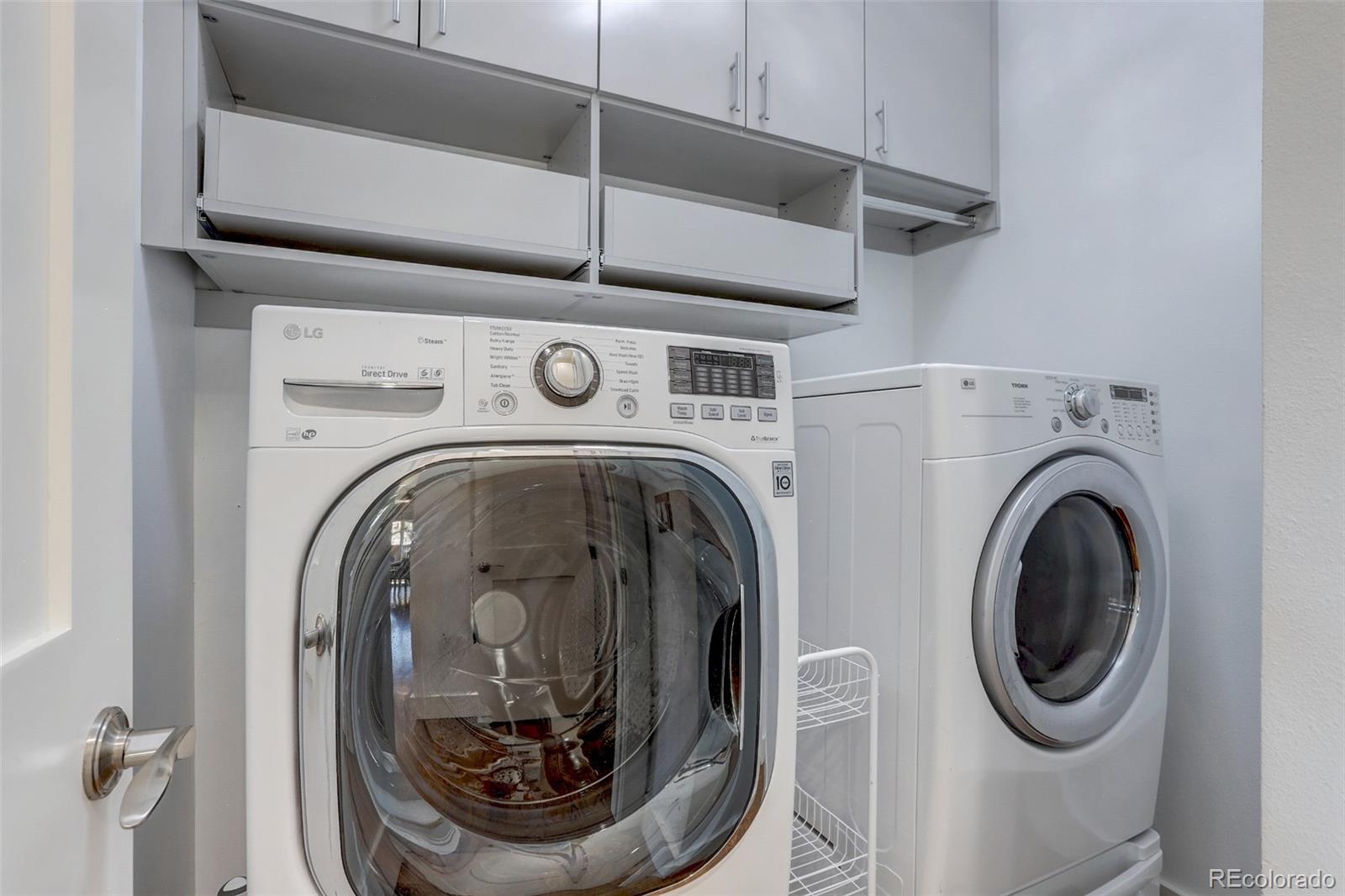 4238 Stuart Street Denver, CO 80212 - Photo 19 of 50 a utility room with dryer and washer