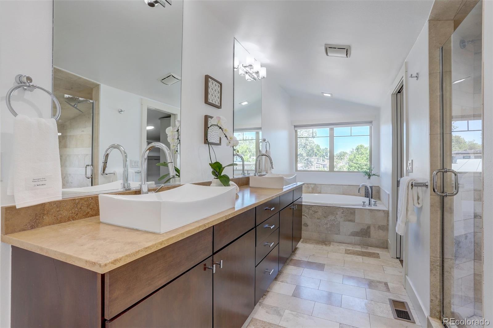 4238 Stuart Street Denver, CO 80212 - Photo 24 of 50 a bathroom with a sink and a mirror