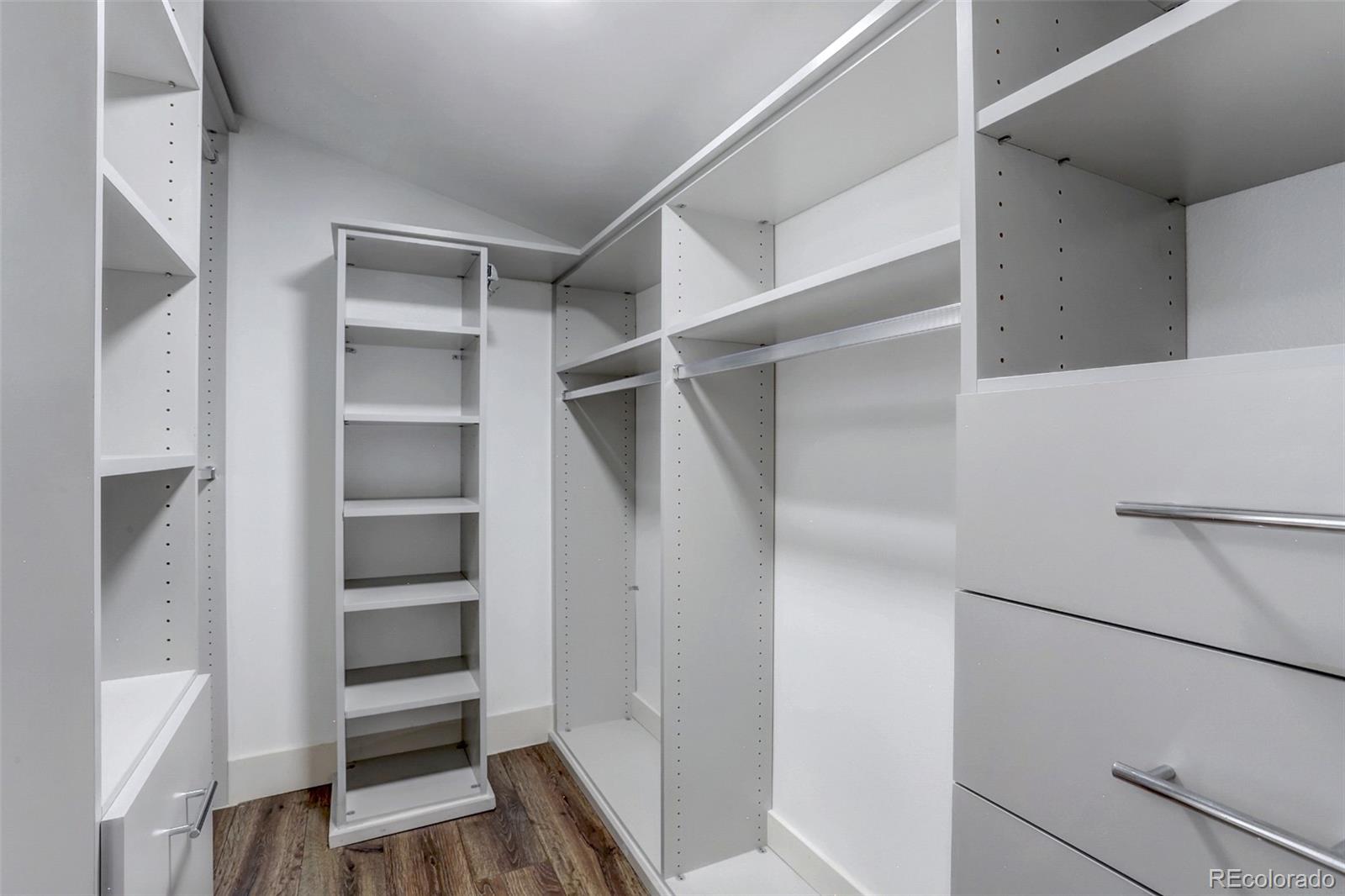 4238 Stuart Street Denver, CO 80212 - Photo 26 of 50 a view of walk in closet with empty racks