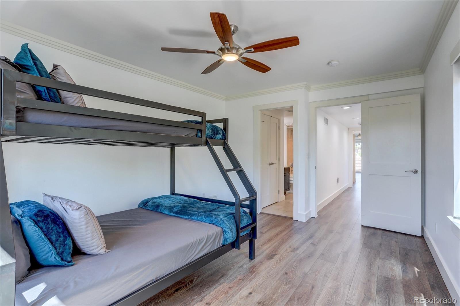 4238 Stuart Street Denver, CO 80212 - Photo 29 of 50 a bedroom with a bed and a ceiling fan