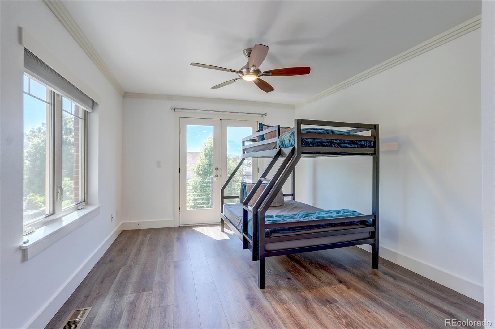 4238 Stuart Street Denver, CO 80212 - Photo 30 of 50 a room with wooden floors pool table furniture and windows
