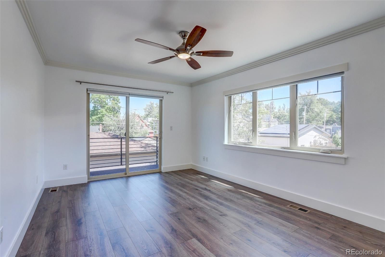 4238 Stuart Street Denver, CO 80212 - Photo 33 of 50 a view of empty room with wooden floor and fan