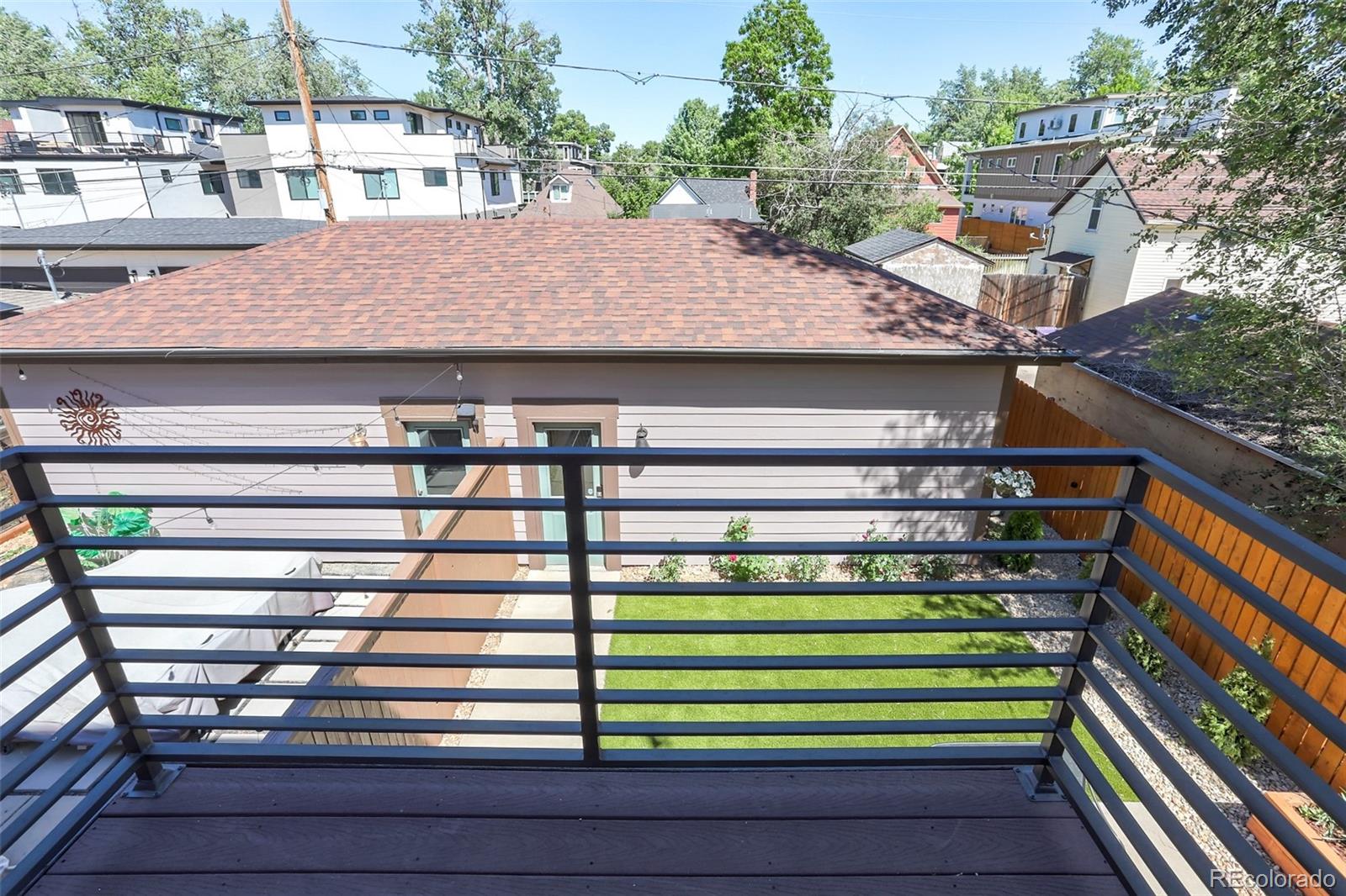 4238 Stuart Street Denver, CO 80212 - Photo 35 of 50 a view of a wooden chairs on the roof deck