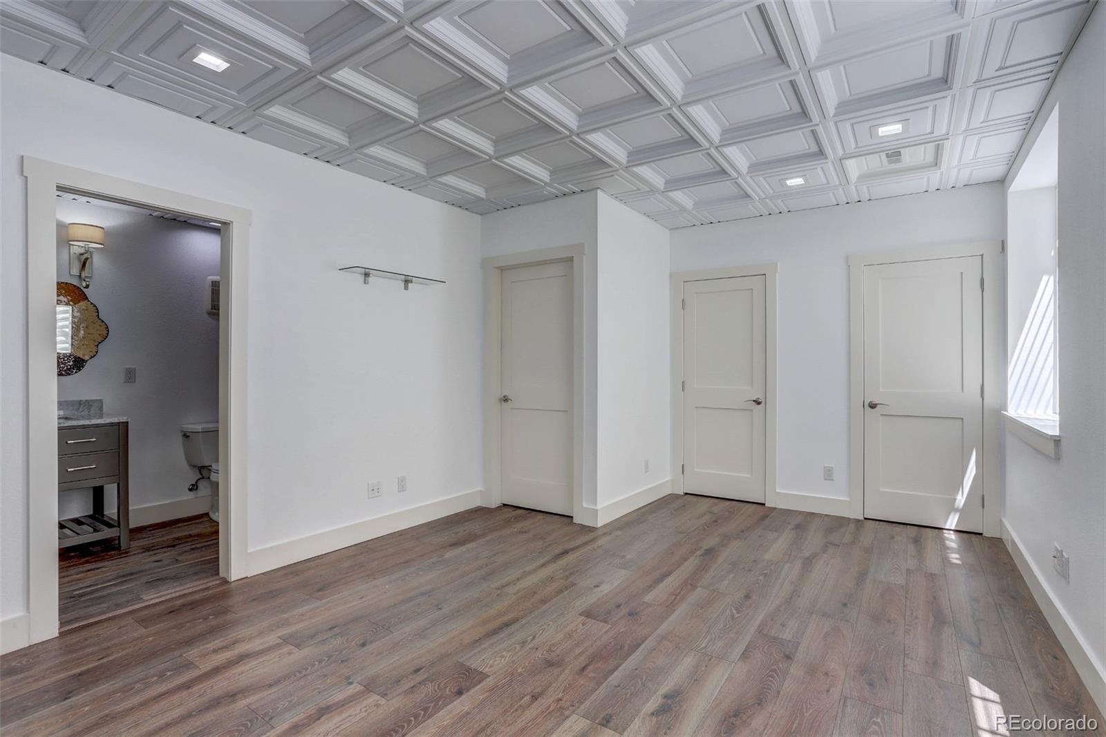 4238 Stuart Street Denver, CO 80212 - Photo 37 of 50 wooden floor in an empty room with a window