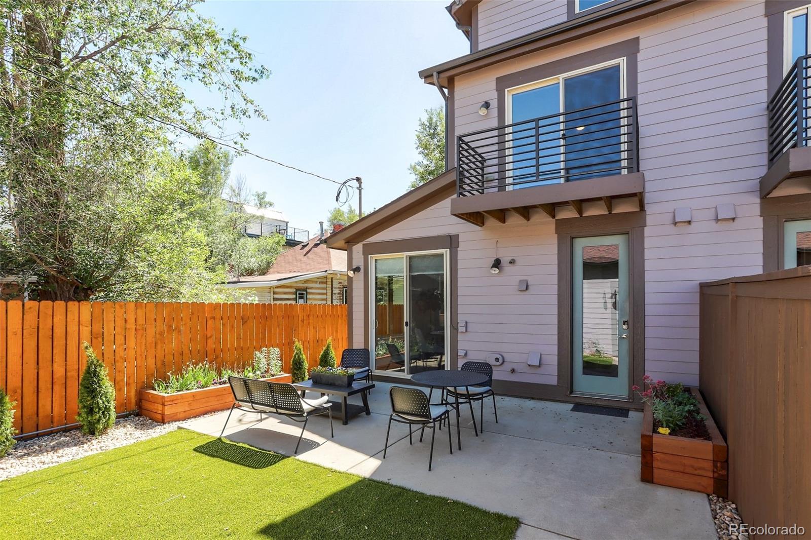 4238 Stuart Street Denver, CO 80212 - Photo 41 of 50 a backyard of a house with outdoor seating