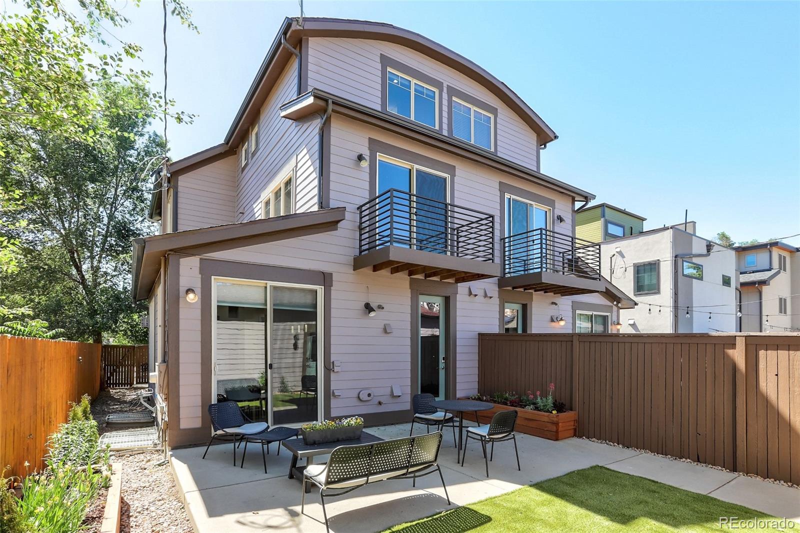 4238 Stuart Street Denver, CO 80212 - Photo 42 of 50 a front view of a house with garden