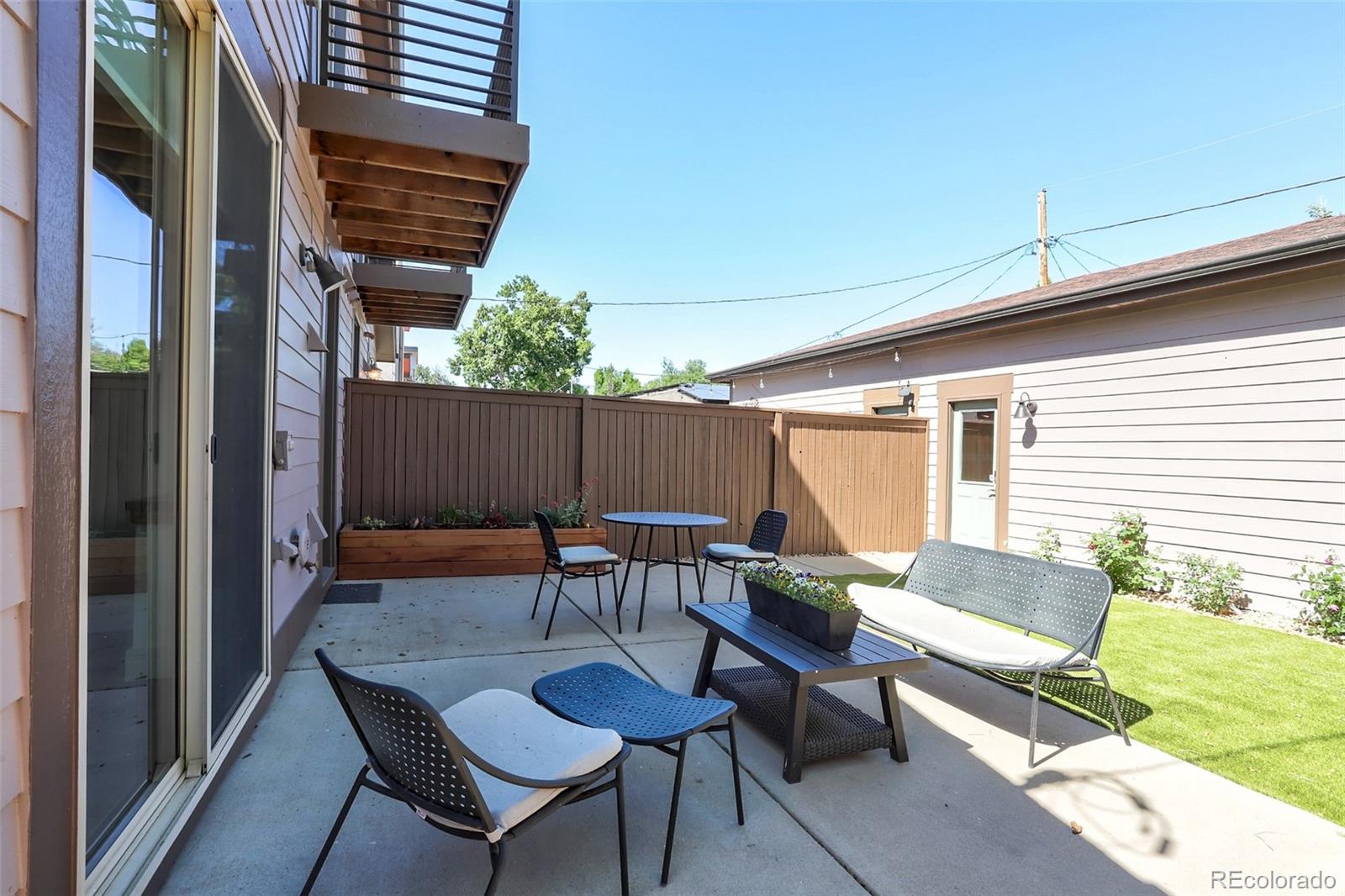 4238 Stuart Street Denver, CO 80212 - Photo 43 of 50 a backyard of a house with table and chairs