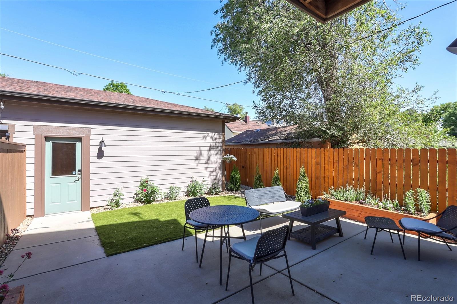 4238 Stuart Street Denver, CO 80212 - Photo 44 of 50 a backyard of a house with outdoor seating