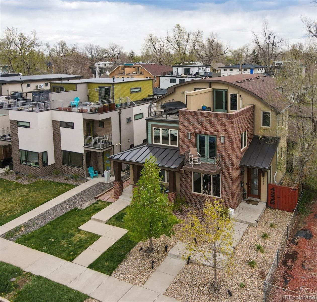 4238 Stuart Street Denver, CO 80212 - Photo 5 of 50 a front view of a house with a yard
