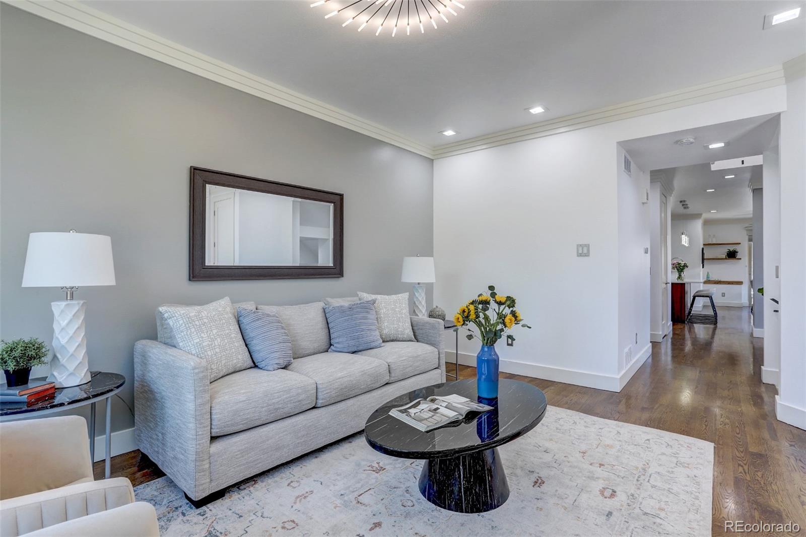 4238 Stuart Street Denver, CO 80212 - Photo 6 of 50 a living room with furniture and wooden floor