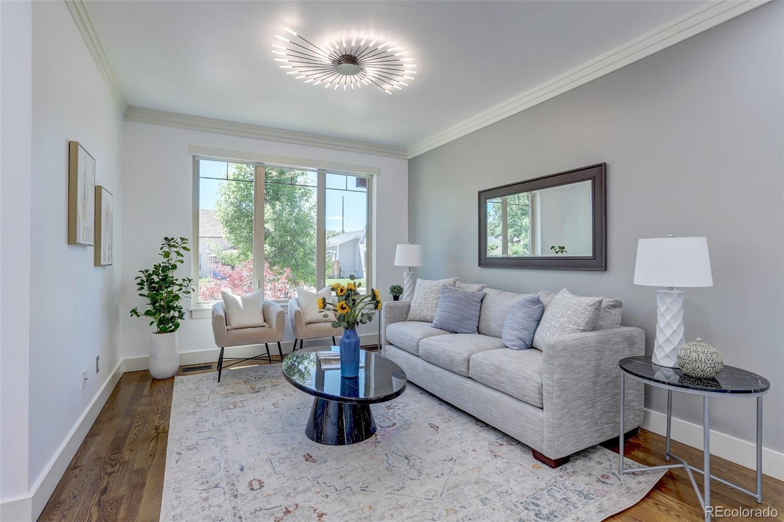 4238 Stuart Street Denver, CO 80212 - Photo 7 of 50 a living room with furniture and a potted plant