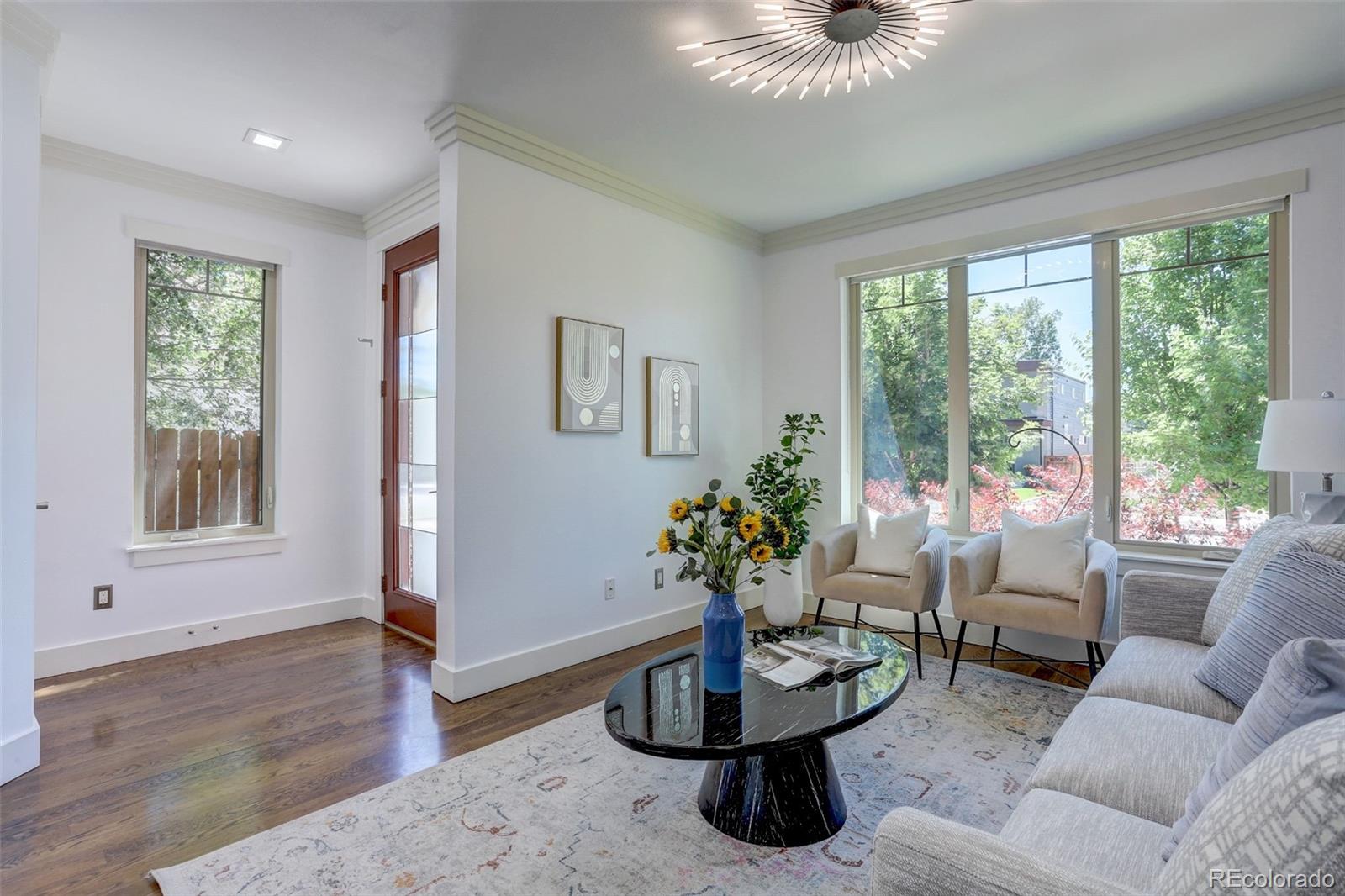 4238 Stuart Street Denver, CO 80212 - Photo 8 of 50 a living room with furniture and a potted plant